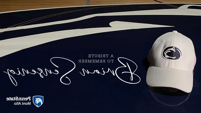 "A Tribute to Brian Sensenig" next to white Penn State cap. 